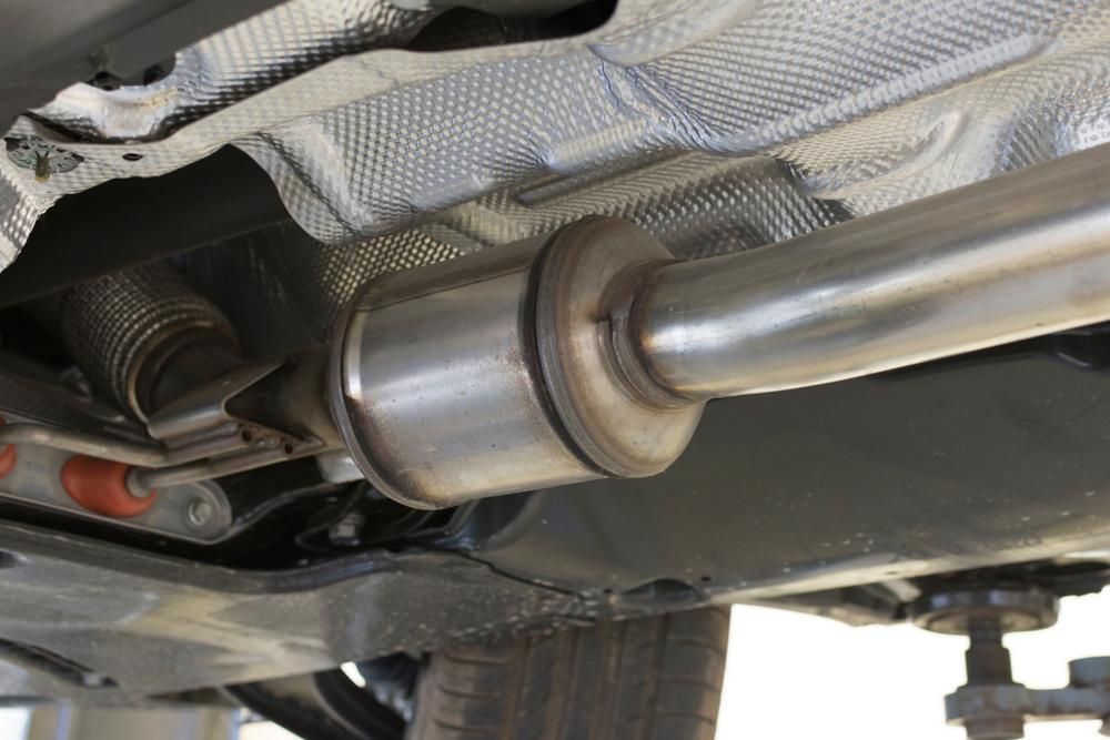 A Close up Of a Exhaust Pipe on The Underside of A Car — Lismore Car Repairs in Lismore, NSW