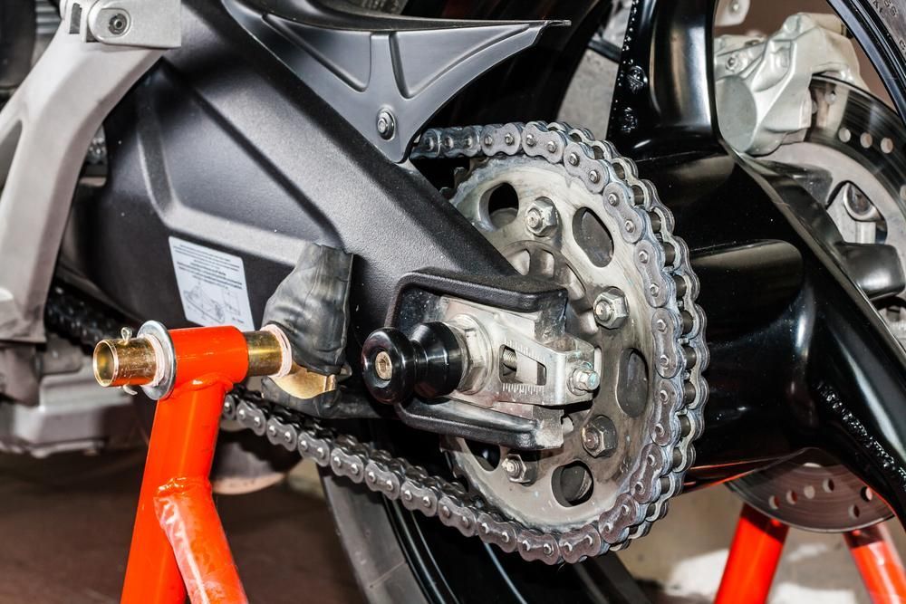 A Close up Of a Motorcycle Chain on A Stand — Lismore Car Repairs in Lismore, NSW