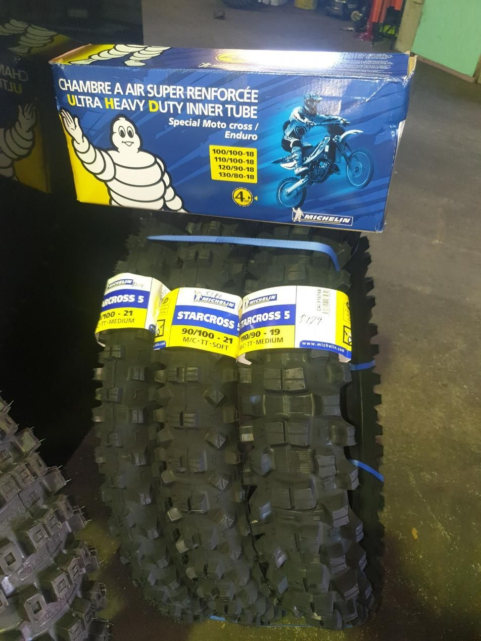 A Pair of Michelin Motorcycle Tires Are Stacked on Top of Each Other — Lismore Car Repairs in Lismore, NSW