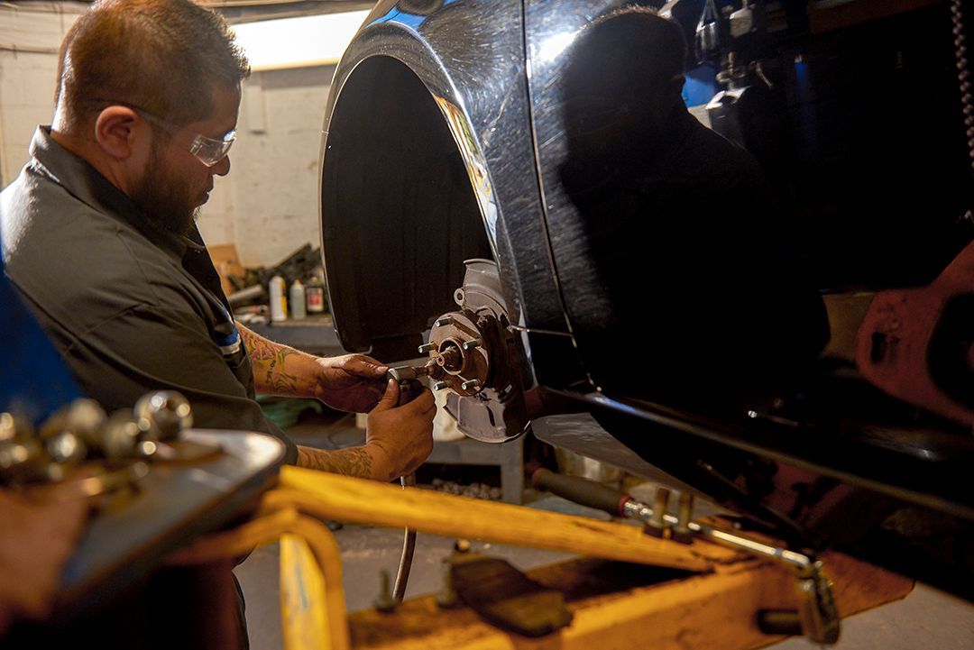 Professional mechanic working on a car engine