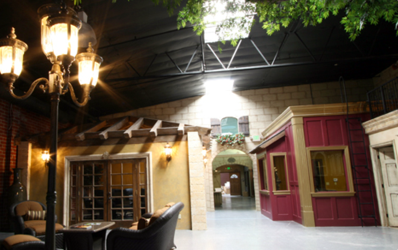 A room with tables and chairs and a lamp post