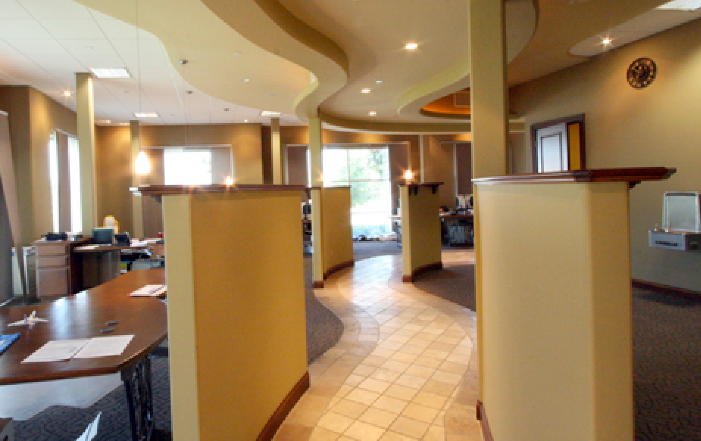 A long hallway with a clock on the wall