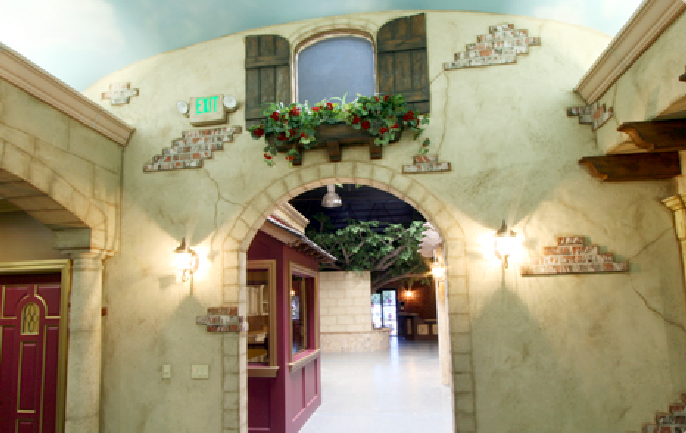 A hallway with a sign that says exit on it