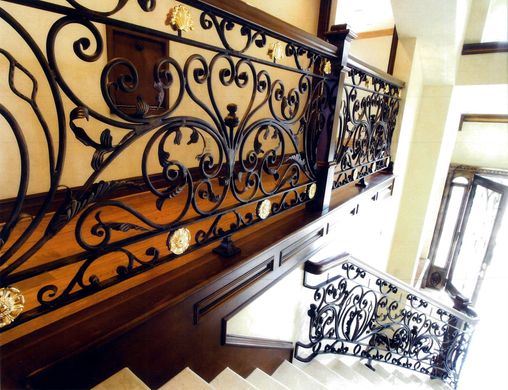 A wrought iron railing on a set of stairs