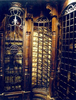 A very ornate room with a clock on the wall