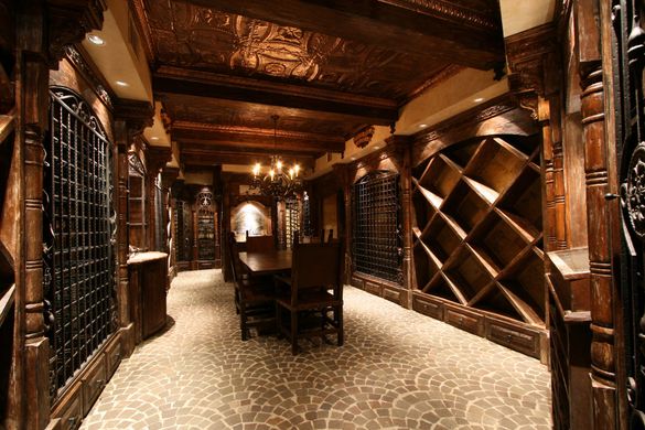 A wine cellar with a table and chairs in it