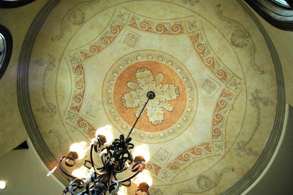 A chandelier is hanging from the ceiling of a building