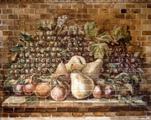 A painting of fruits and vegetables on a brick wall