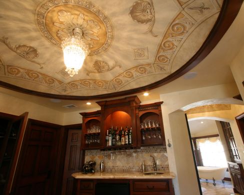 A kitchen with a chandelier hanging from the ceiling