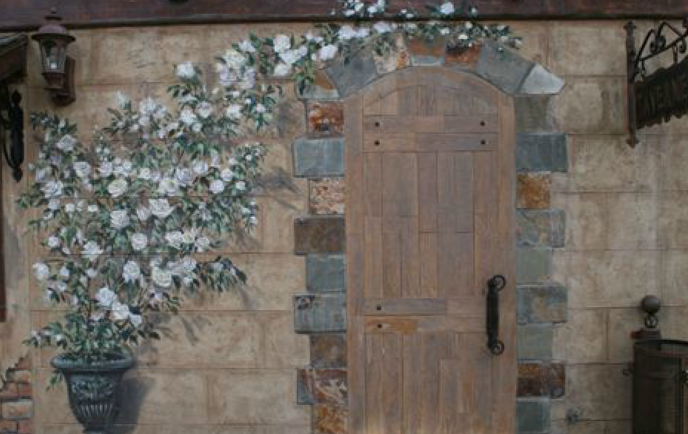 A wooden door with a painting of flowers on it