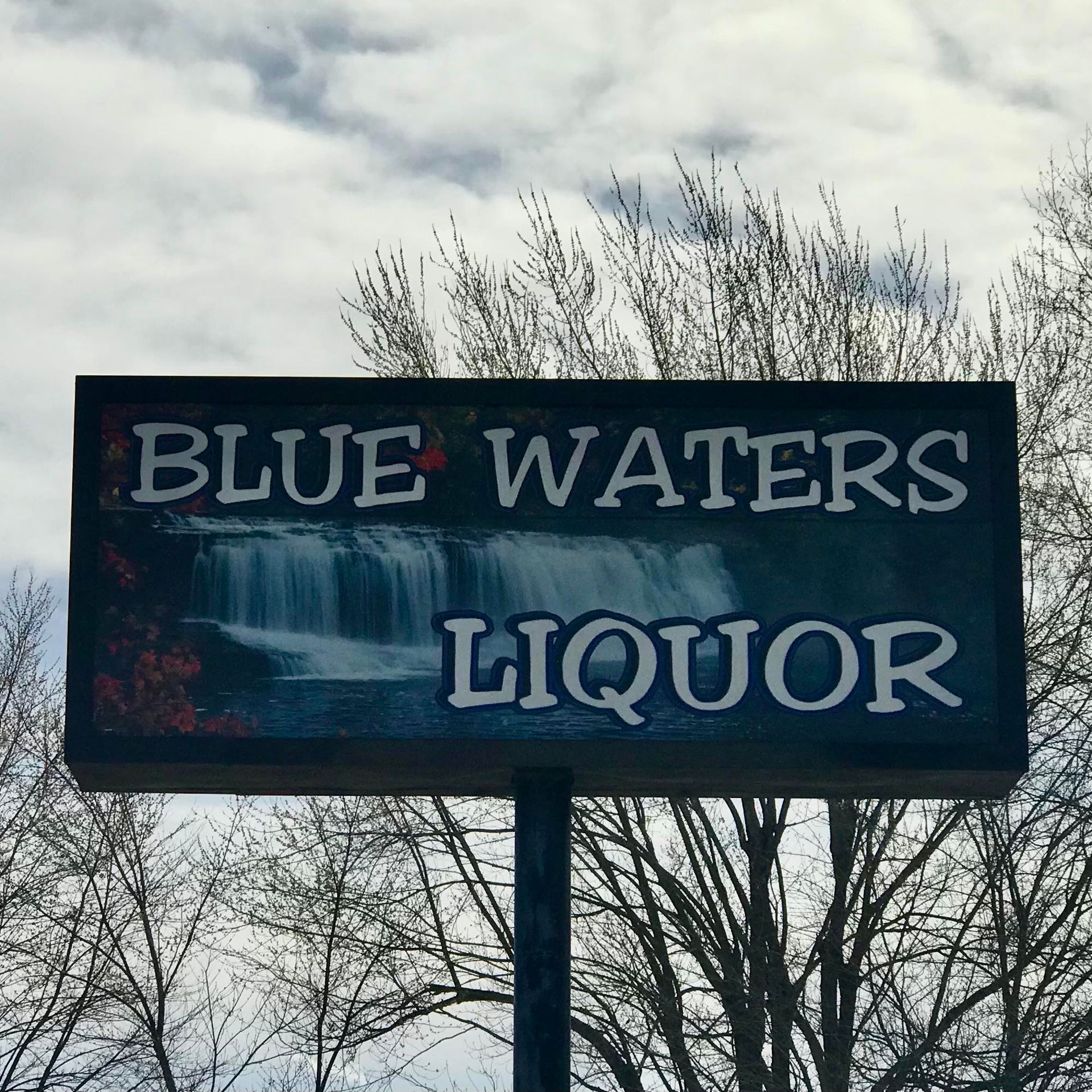 blue waters liquor sign