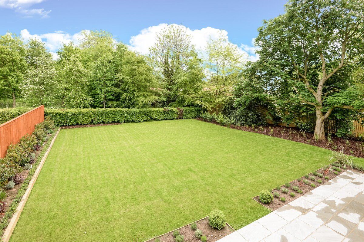 full view of green grass flower garden