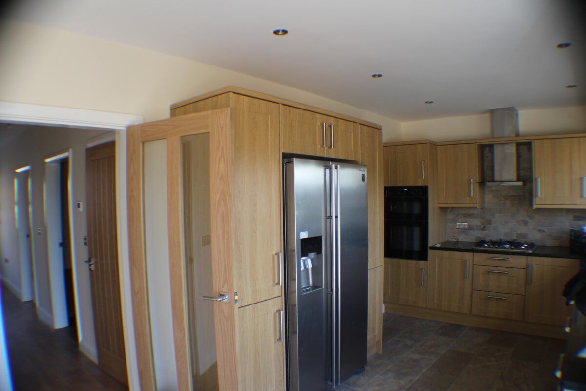 silver fridge in the kitchen