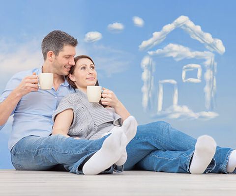 couple drinking coffee and dreaming of their future house