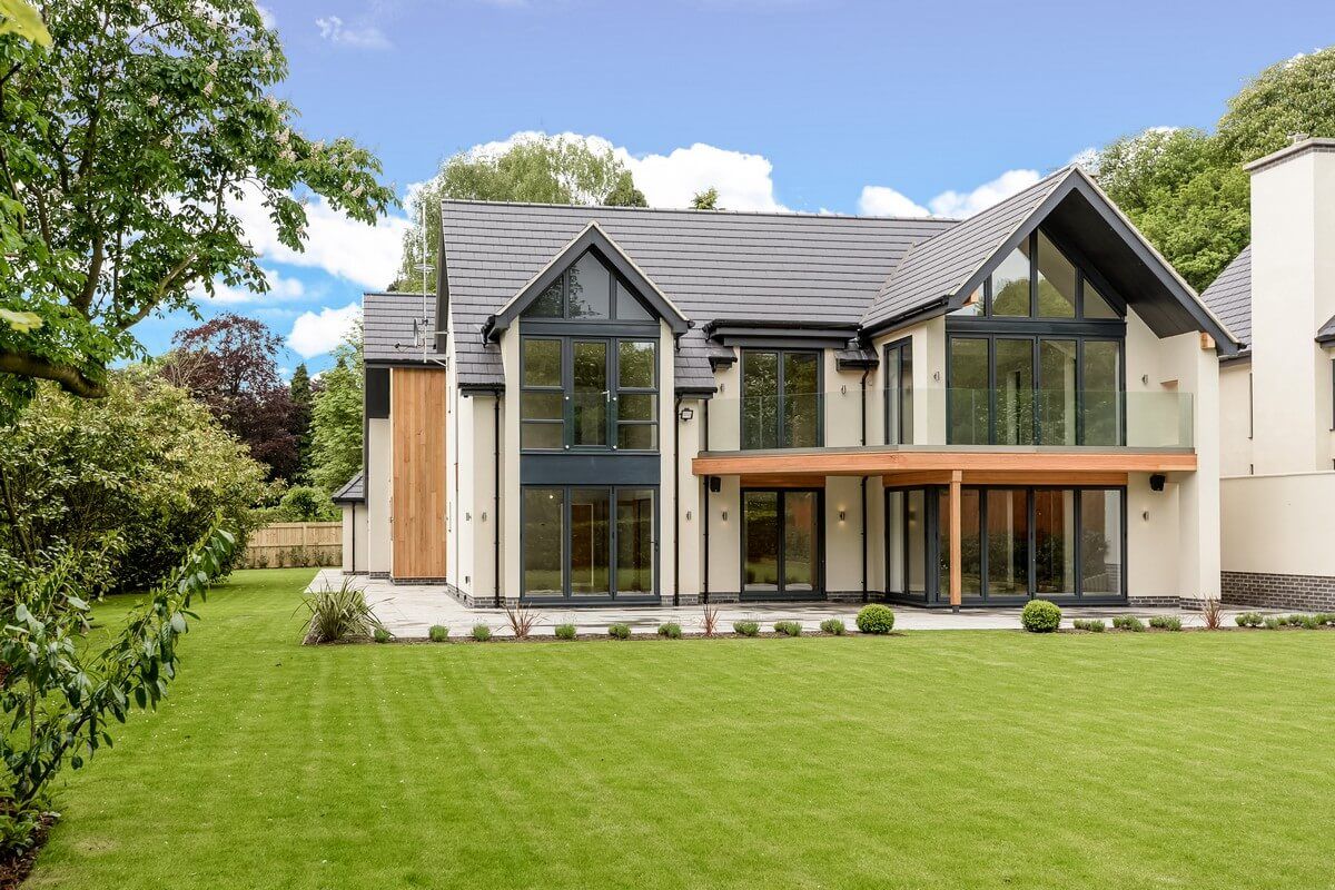 side view of green grass field and house