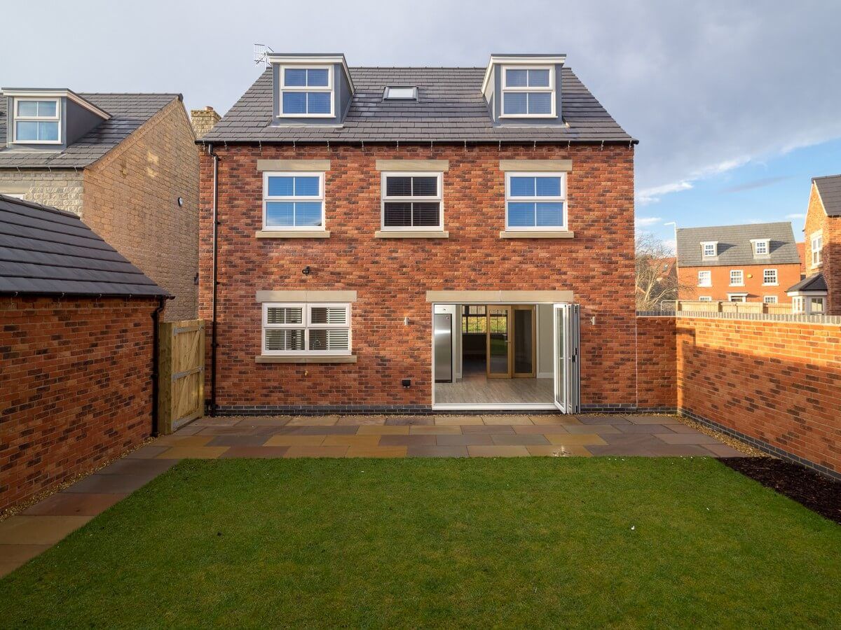 front view of house with smaller green back yard