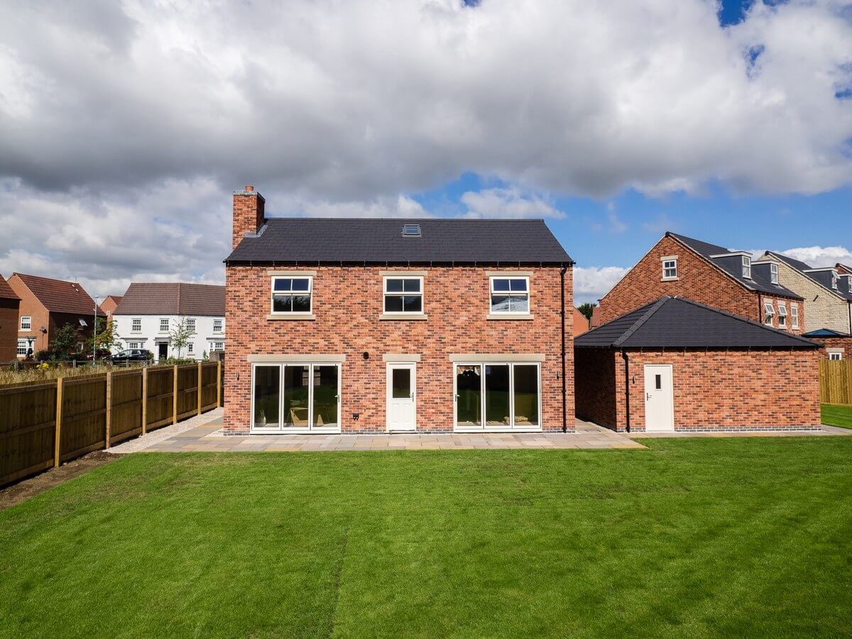 front view of house and back yard