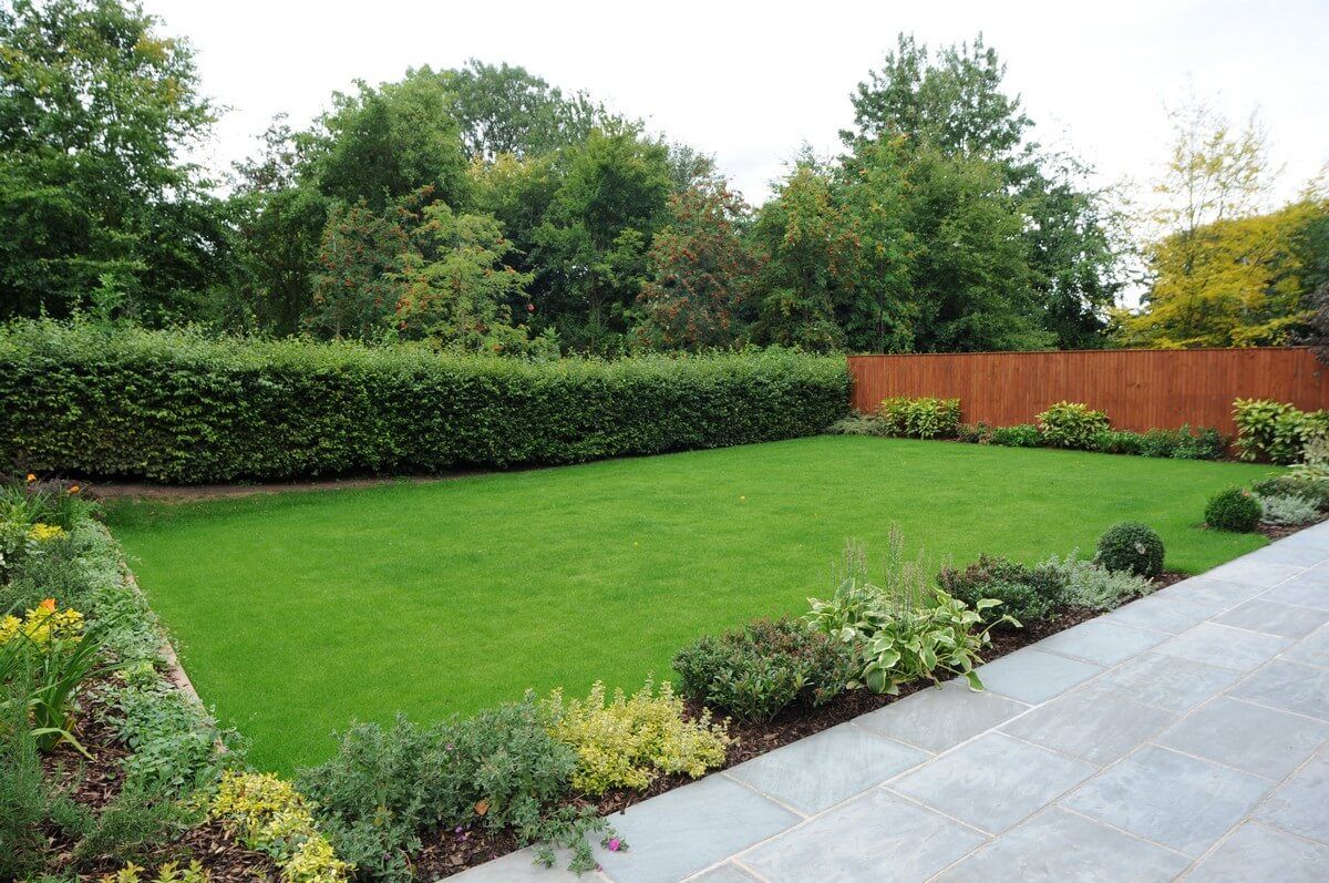 green grass garden with flowers