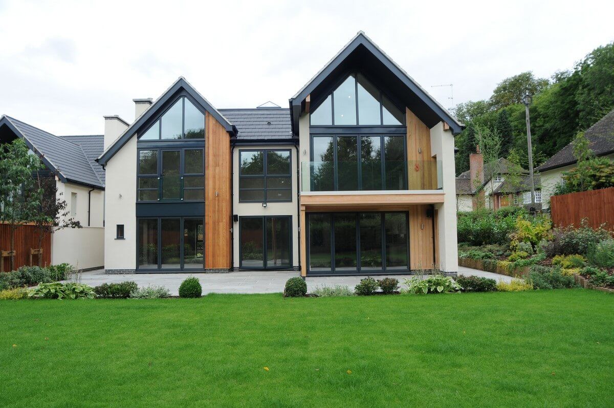 font view of back yard of house with tall glass walls
