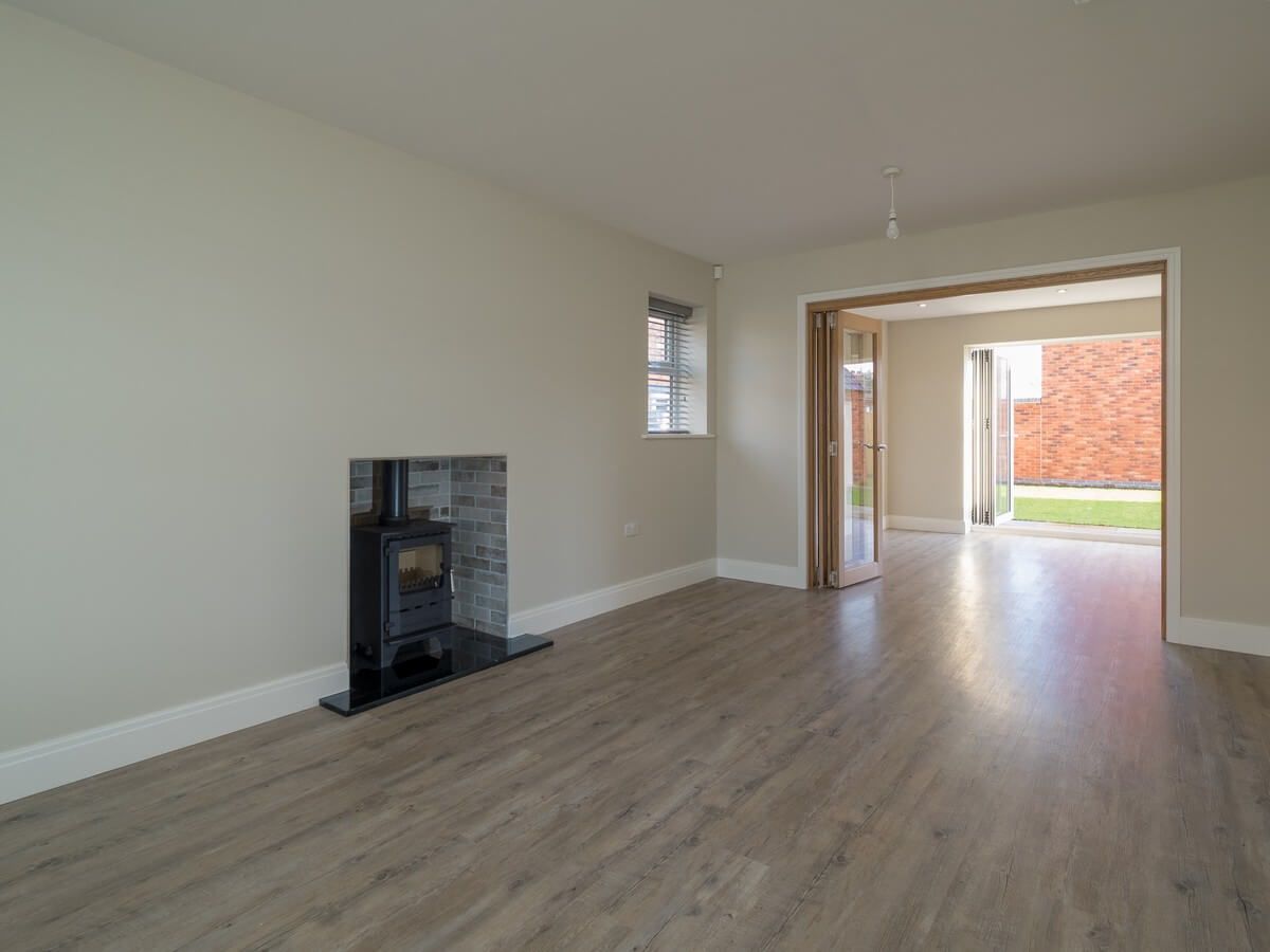 lounge view of fireplace and room exit