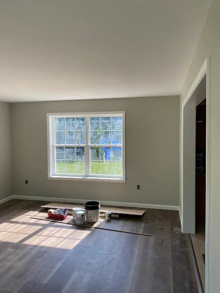 Bedroom painting in Landisville, PA, with cream-colored walls for a warm and elegant finish by Oasis Painting & Drywall.