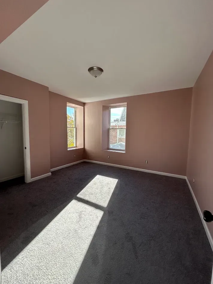 Pink bedroom interior painting by Oasis Painting & Drywall in Germantown, PA.
