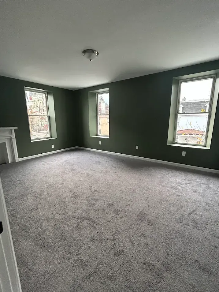 Interior bedroom painting completed in Drexel Hill, PA with a fresh green finish.