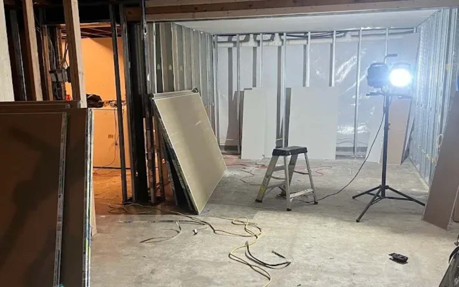 Drywall sheets leaning against walls before installation at a residential project in Drexel Hill, PA.