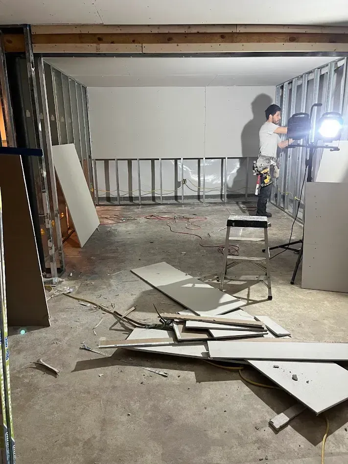 Professional sheetrock installation in a basement project in Philadelphia County, PA.