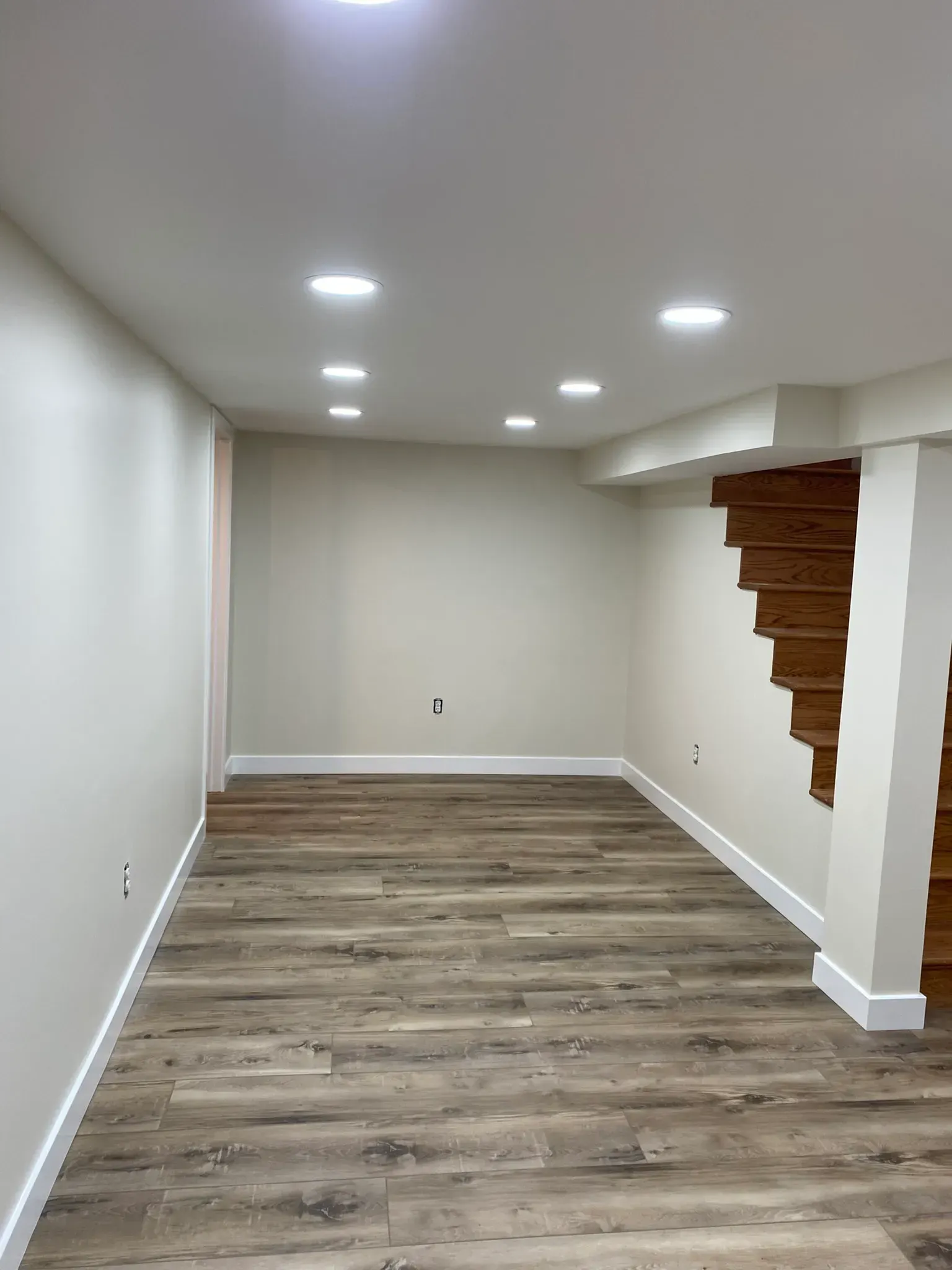 basement drywall finishing and interior painting project in Montgomery County Pennsylvania with smooth walls recessed lights and clean finish