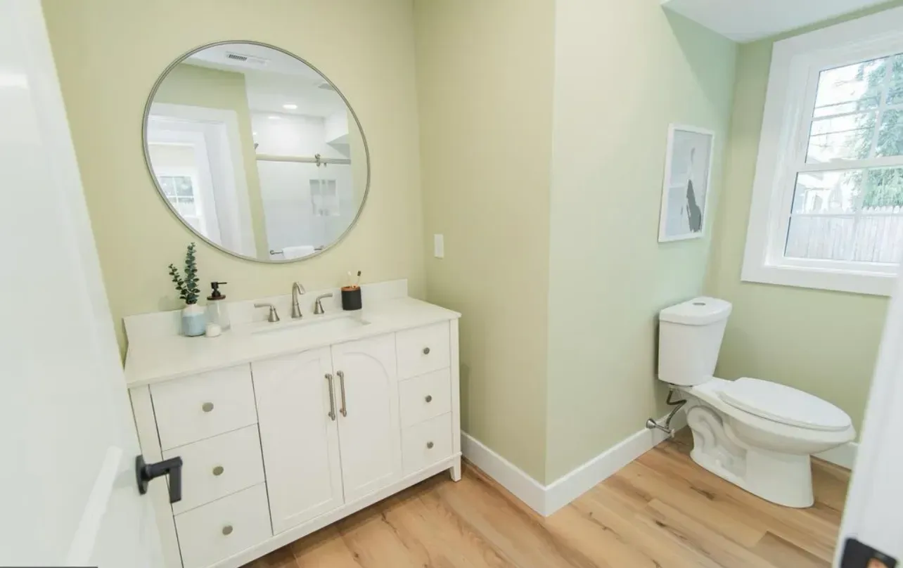 Abington PA bathroom painting – green walls by professional painters Oasis Painting & Drywall.