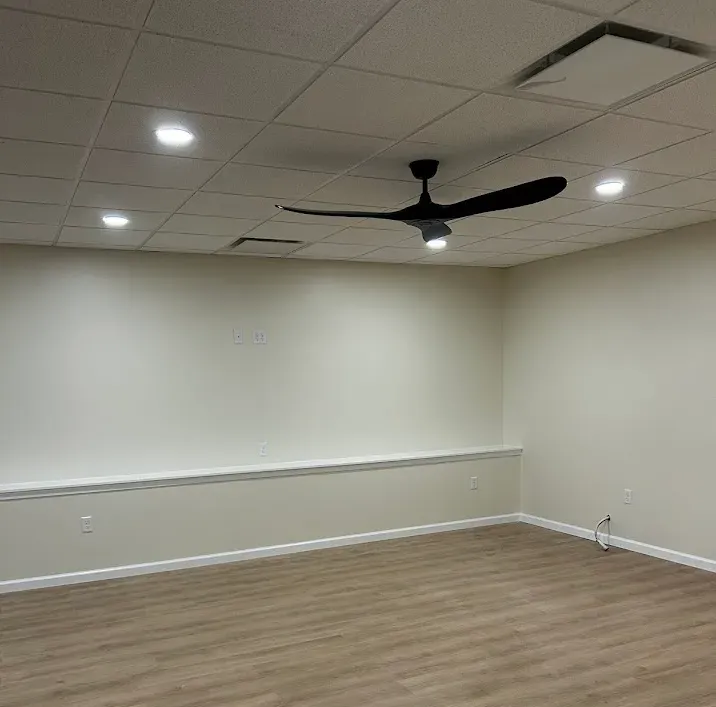 Maple Glen PA basement painting – creamy yellow walls by professional painters Oasis Painting & Drywall.