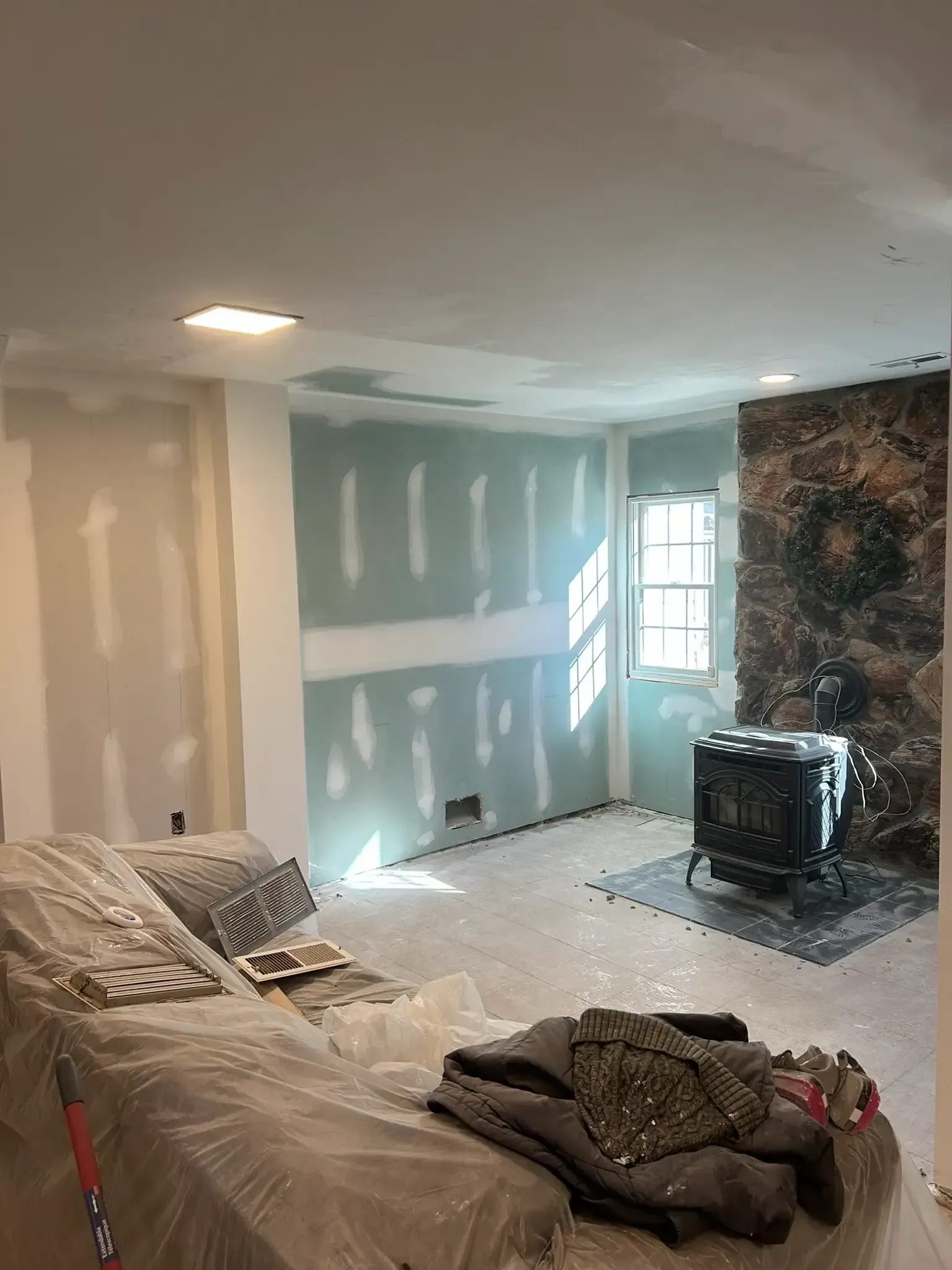 Professional drywall installation with finished black wall in Montgomery County PA