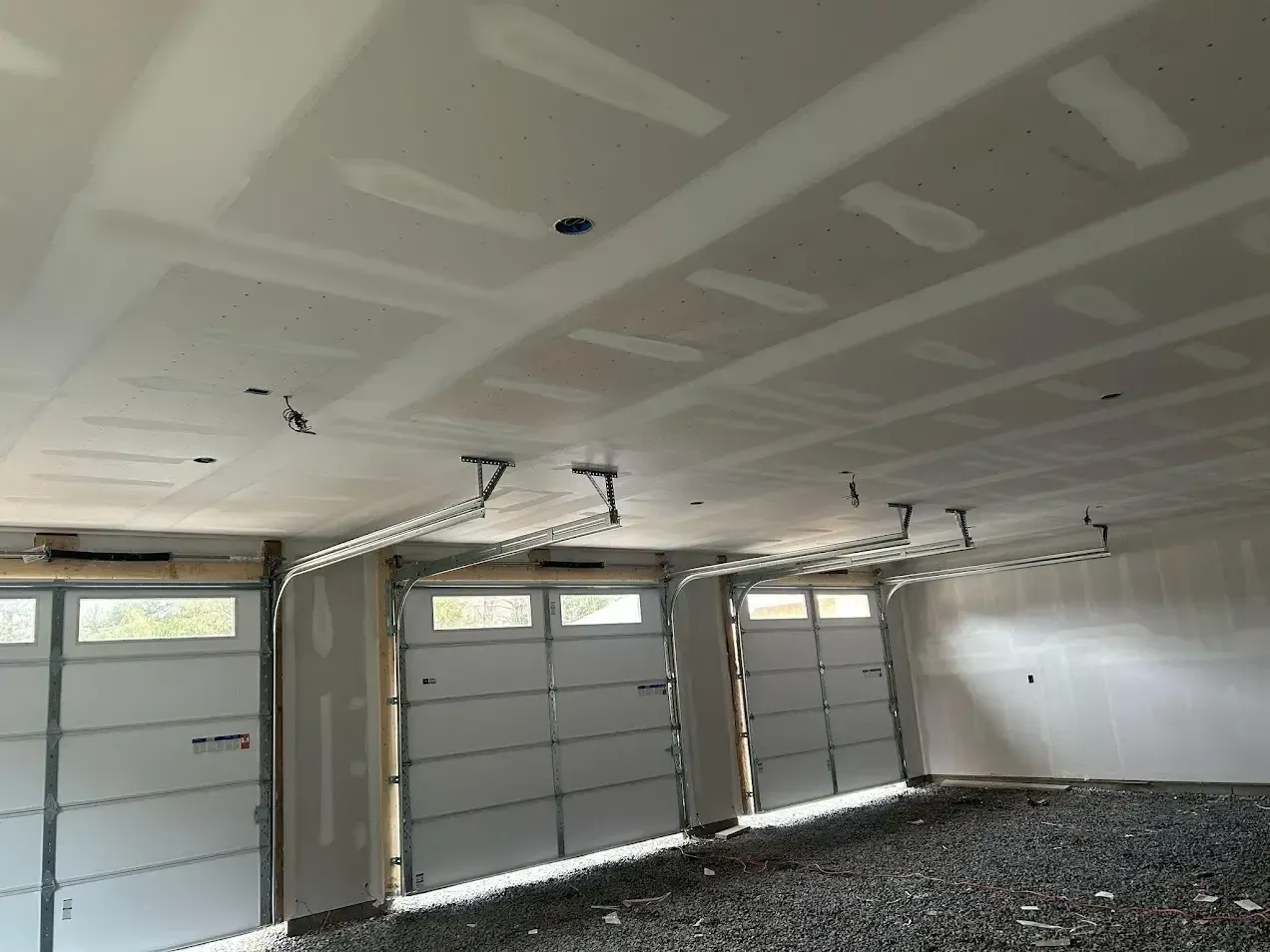 Norristown PA drywall installation – garage ceiling by Oasis Painting & Drywall.