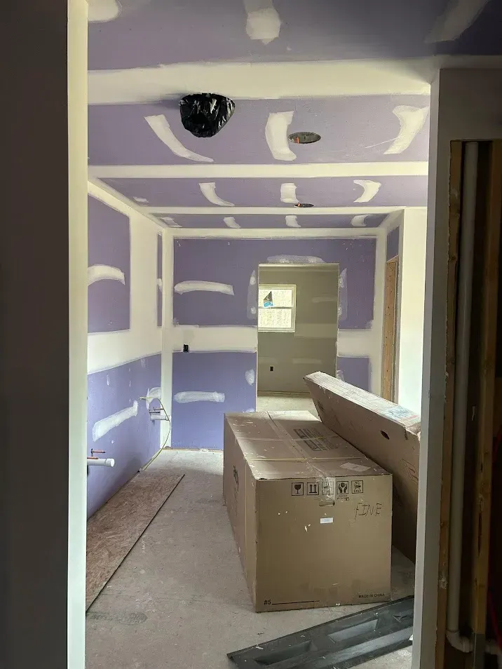 West Chester PA bathroom drywall installation and finishing – purple board by Oasis Painting & Drywall.