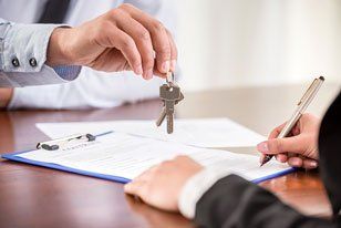 Handing over keys - Commercial Property in Newport News, VA