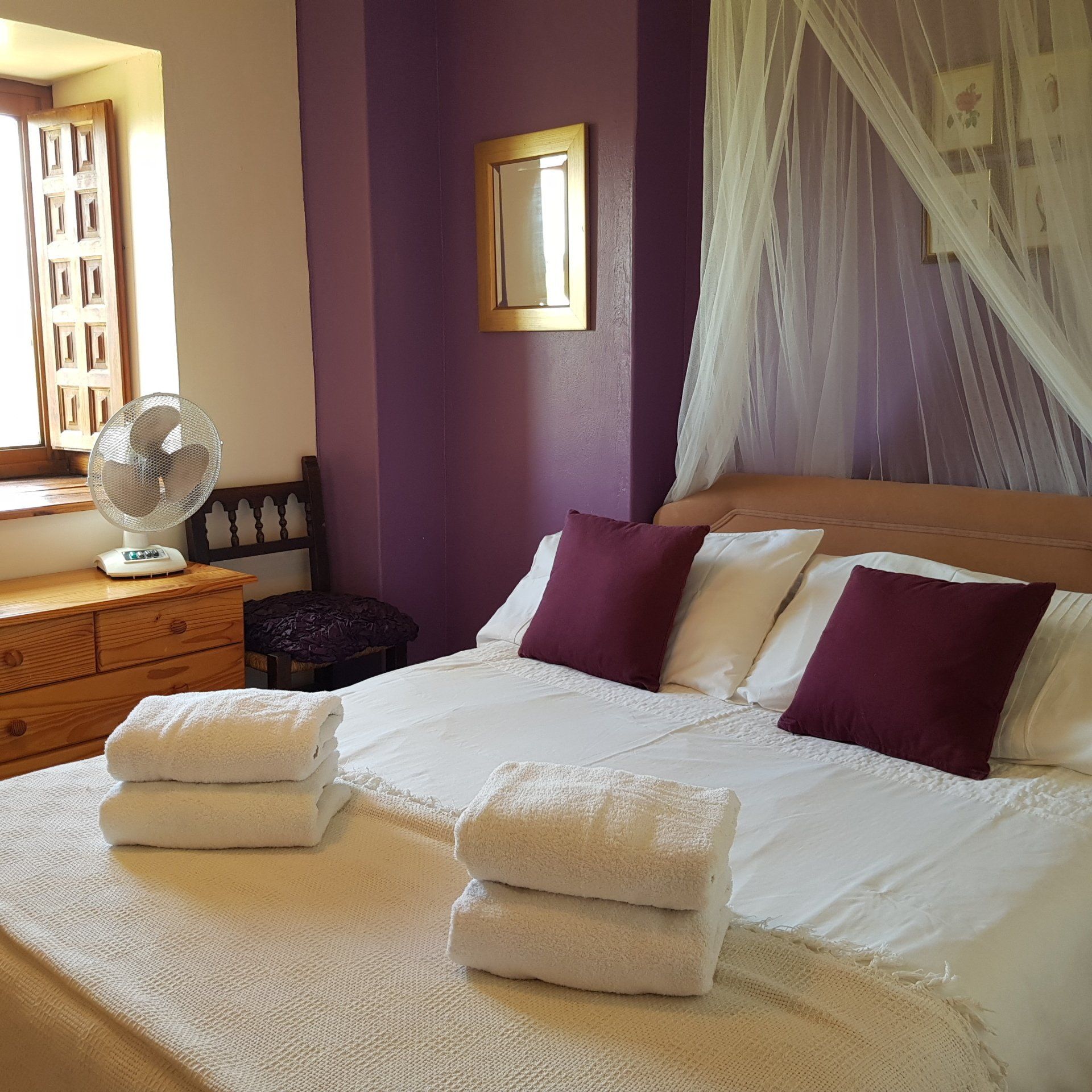 double bedroom with purple walls
