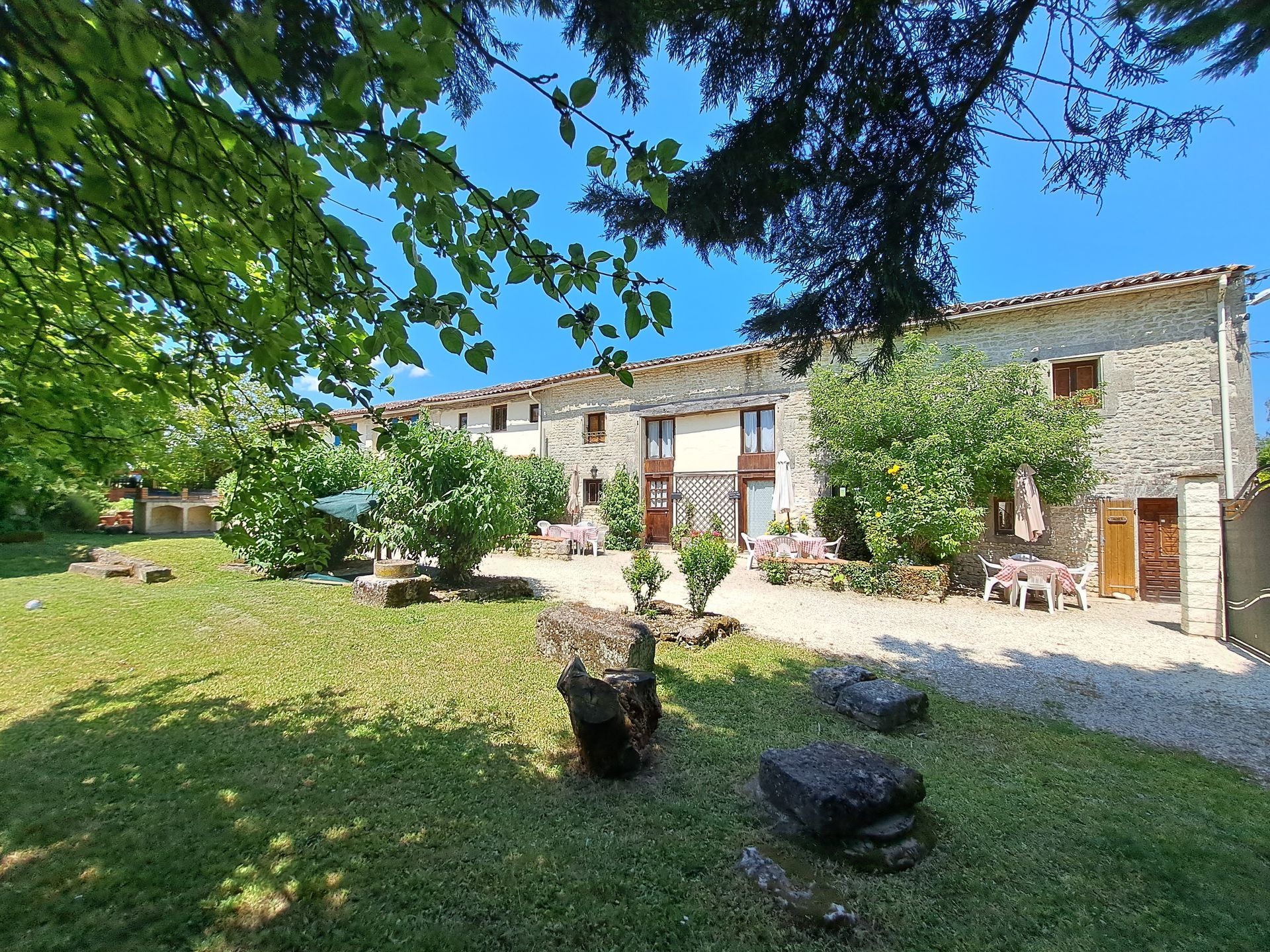 row of stone cottages with a garden in the foreground