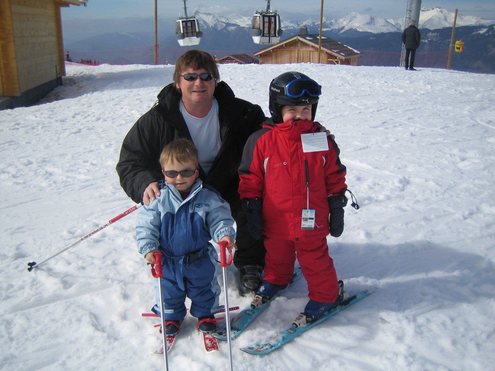 family with young children skiing