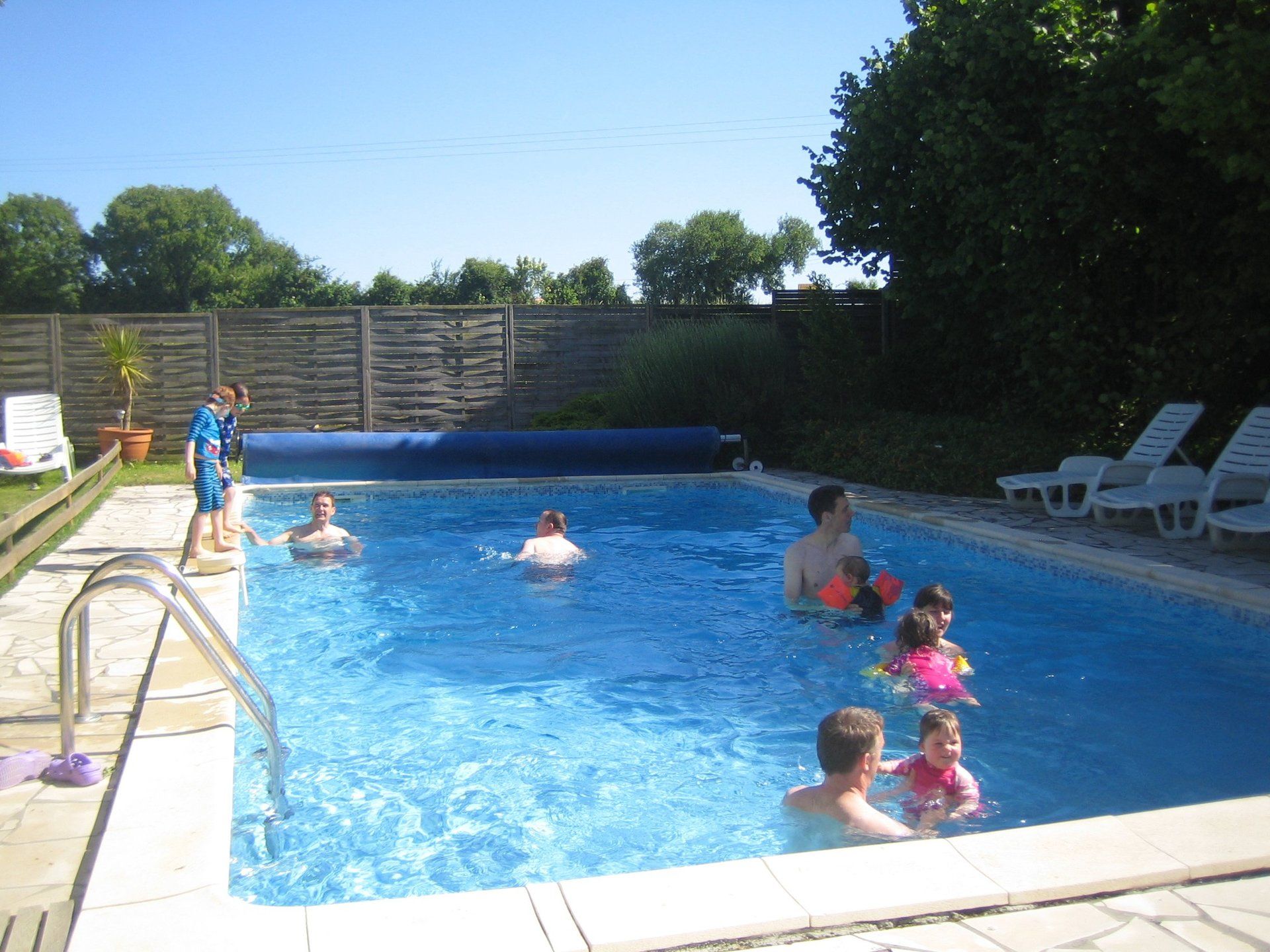children playing in a swimming pool in France