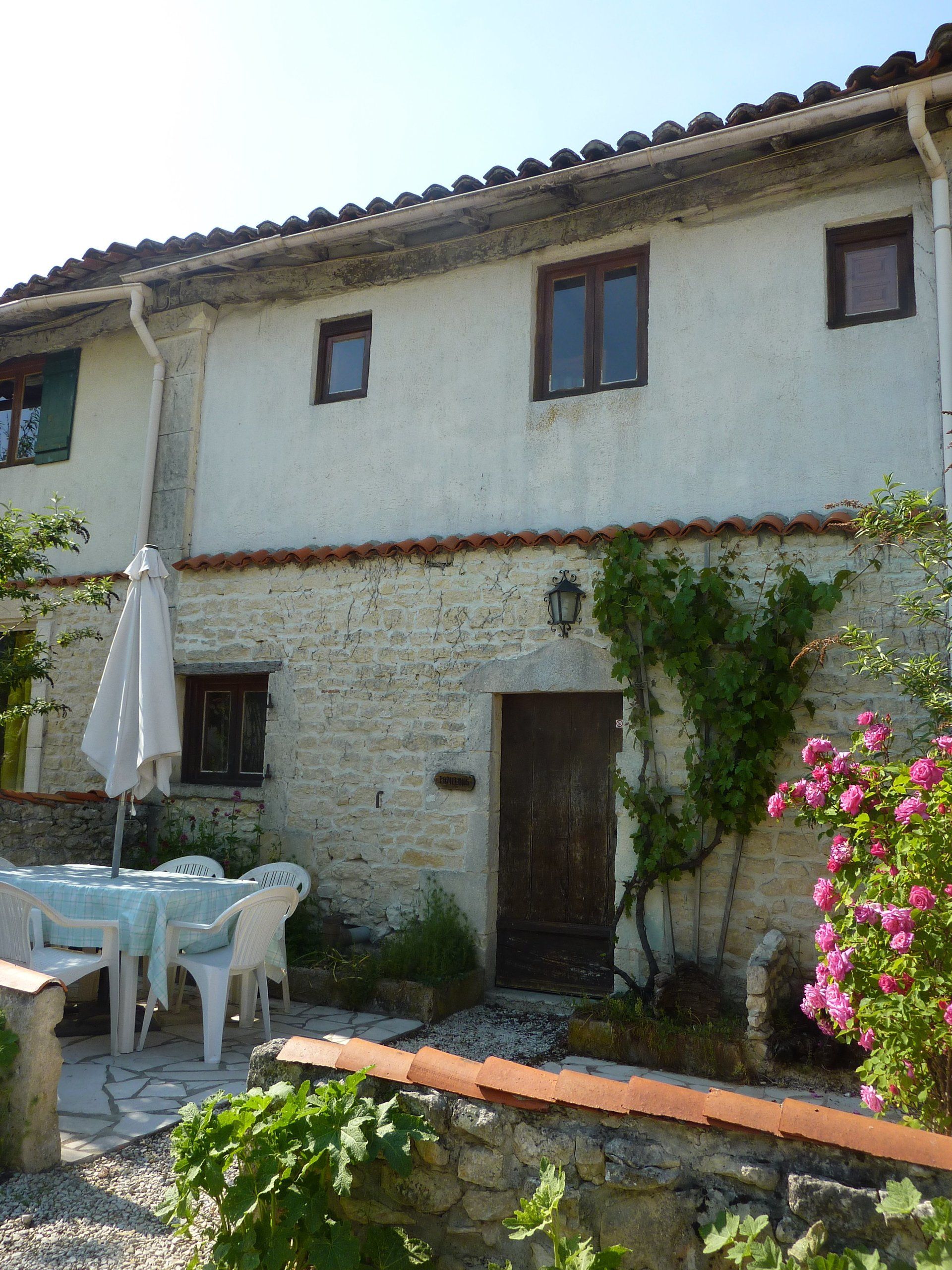 French Holiday cottage with stone front and patio