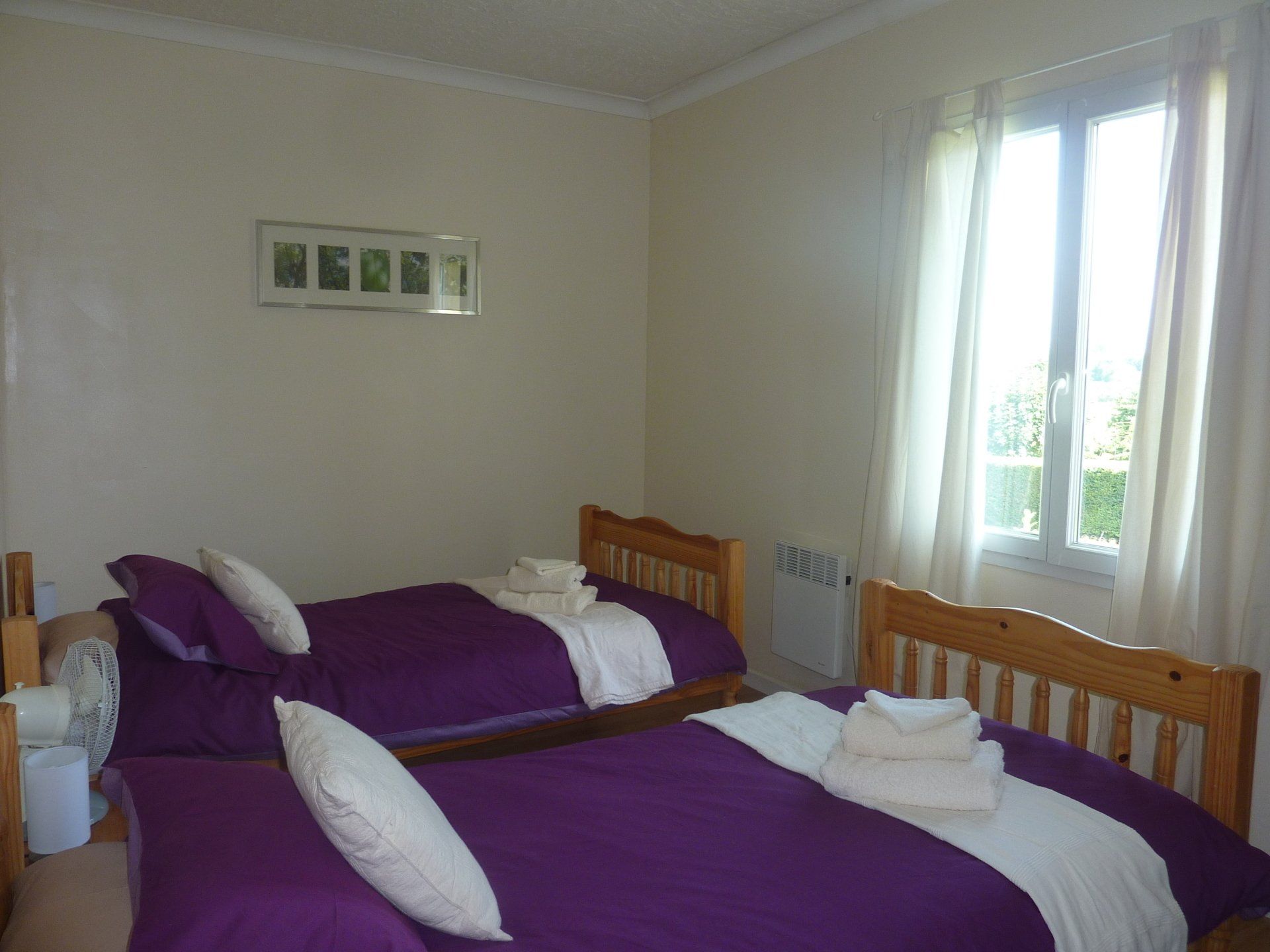 twin beds with purple bedding