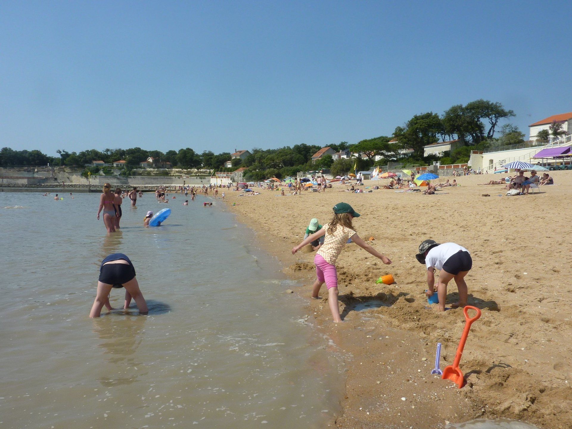 kids playing on a beach