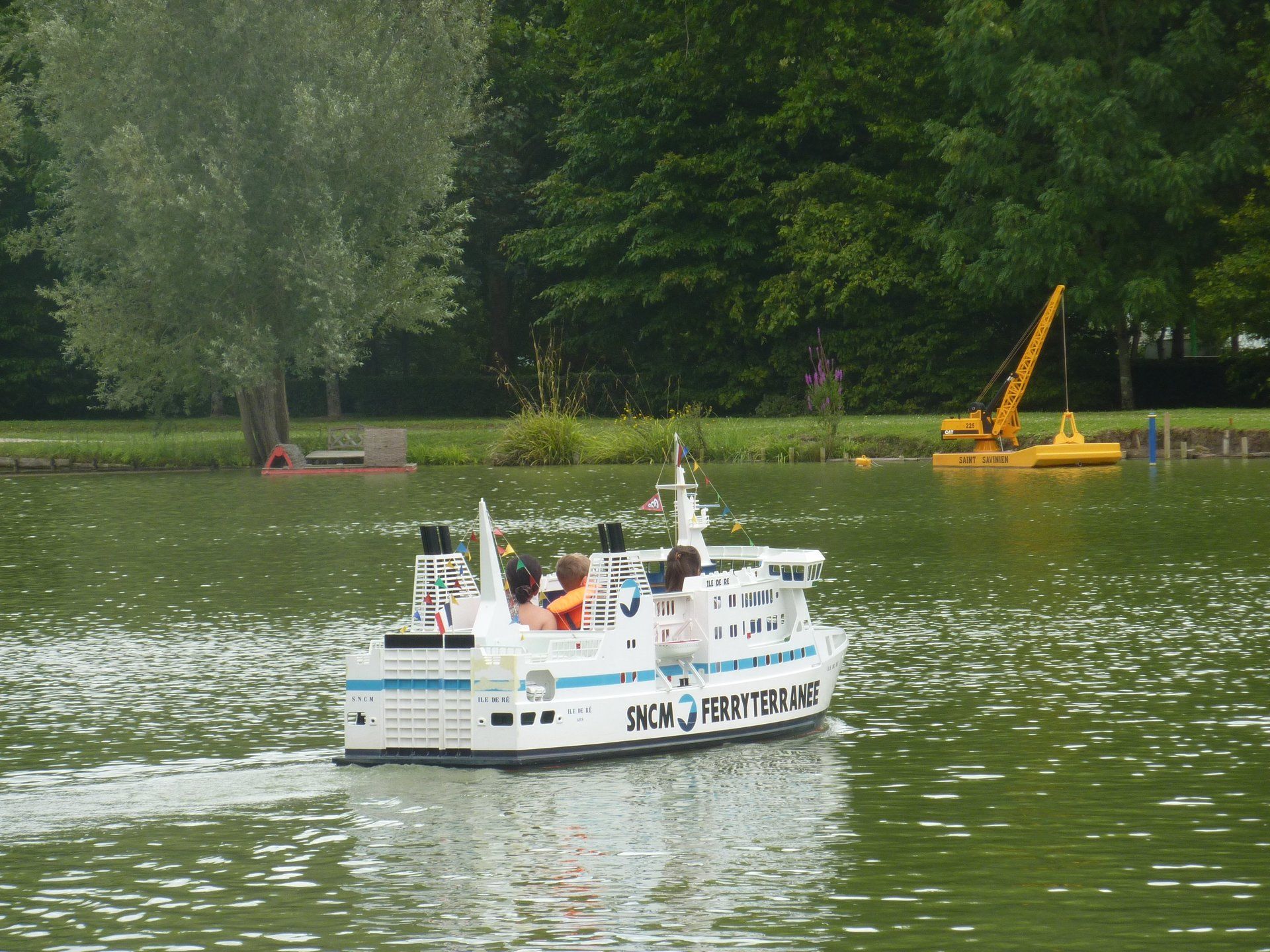 miniature boat on a lake