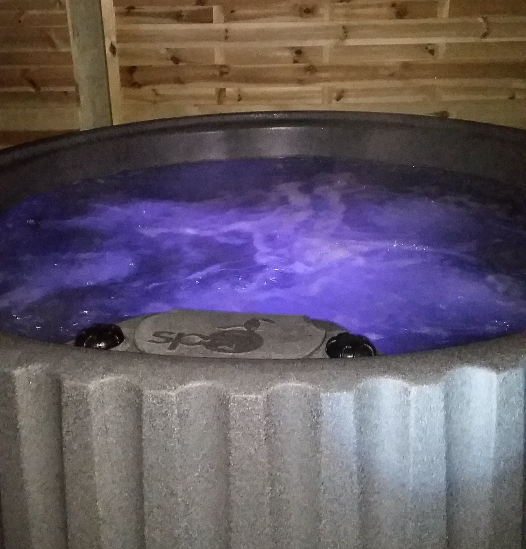 hot tub with a purple underwater light