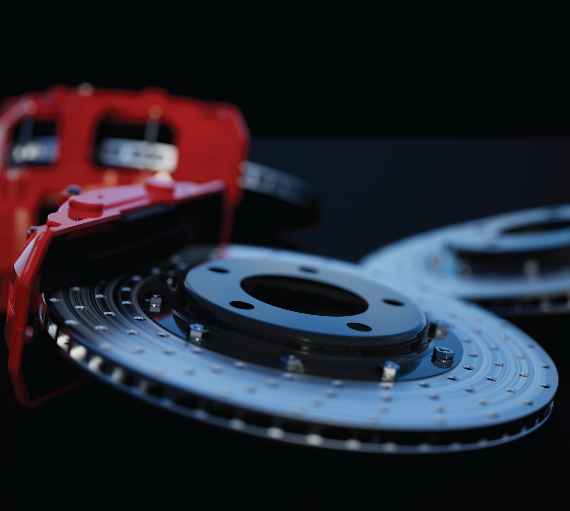 A close up of a brake disc with a red brake caliper