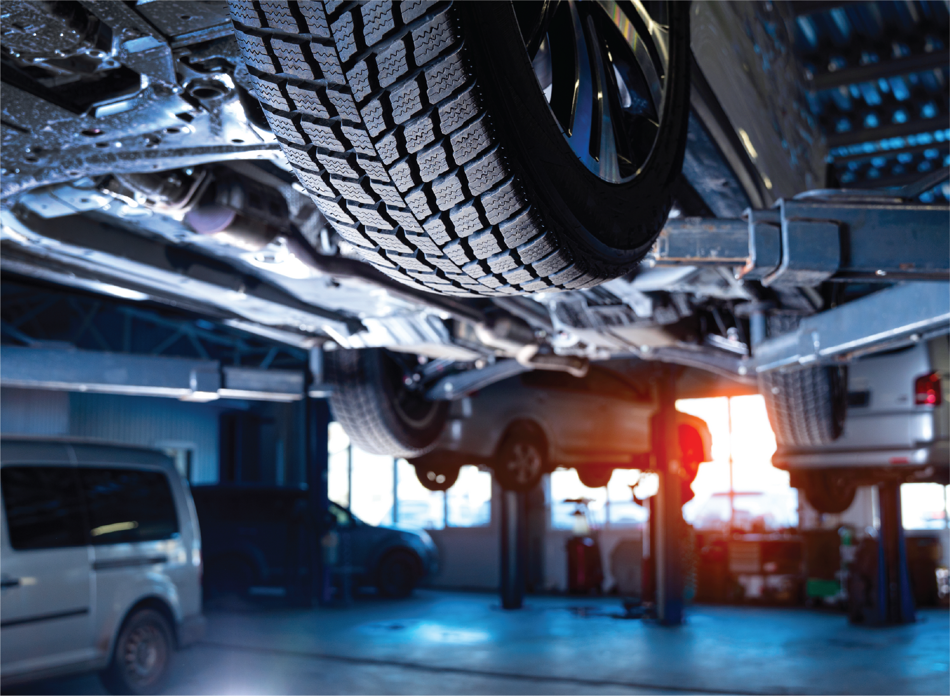 A car is being repaired in a garage.