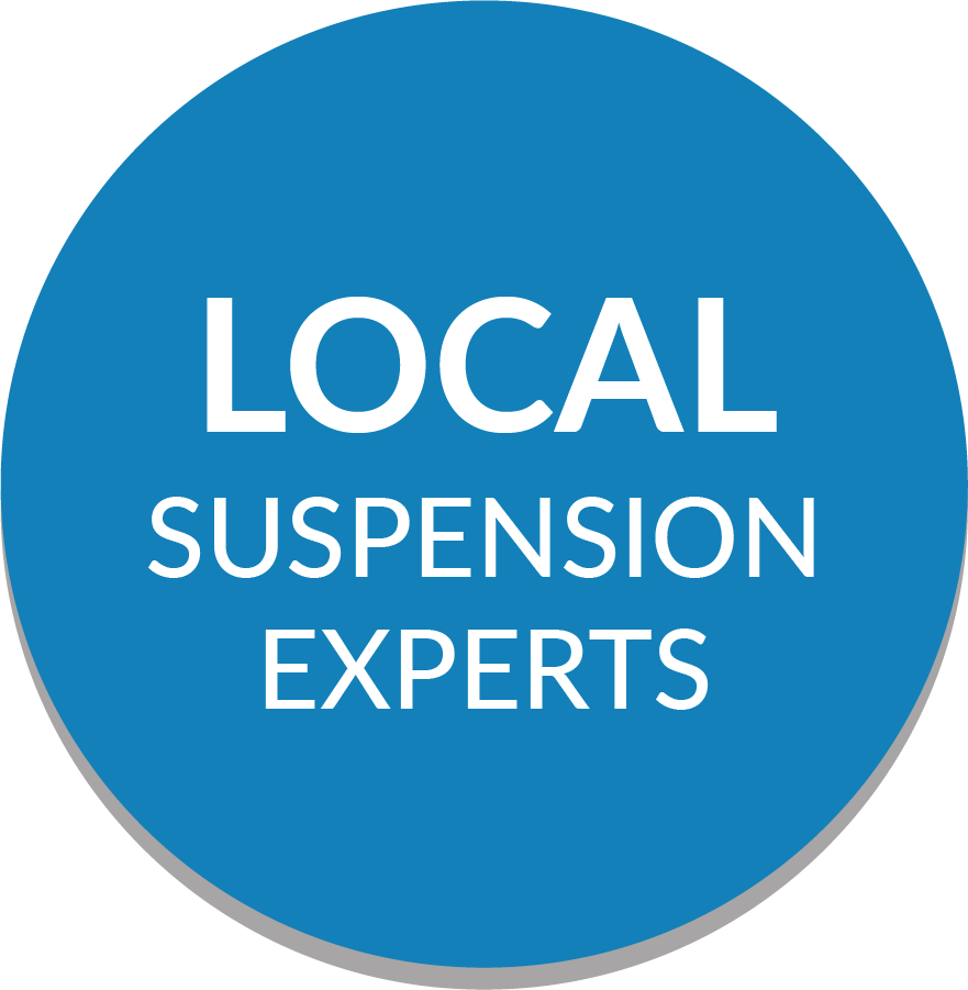 A blue circle with the words local suspension experts on it