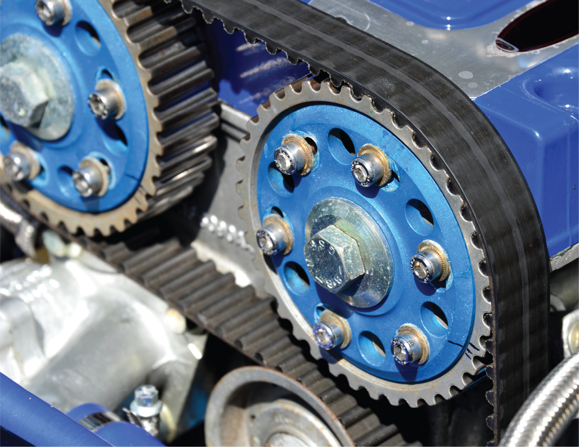 A close up of a blue car engine with blue gears