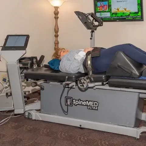 Patient on a Clinic Bed – Raleigh, NC – Raleigh Spine Clinic